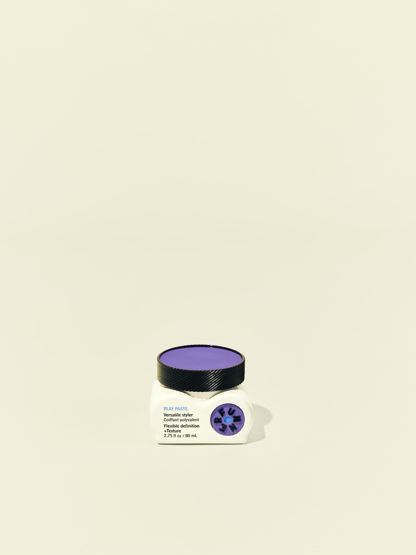 Front solo packshot of Play Paste jar against a beige background
