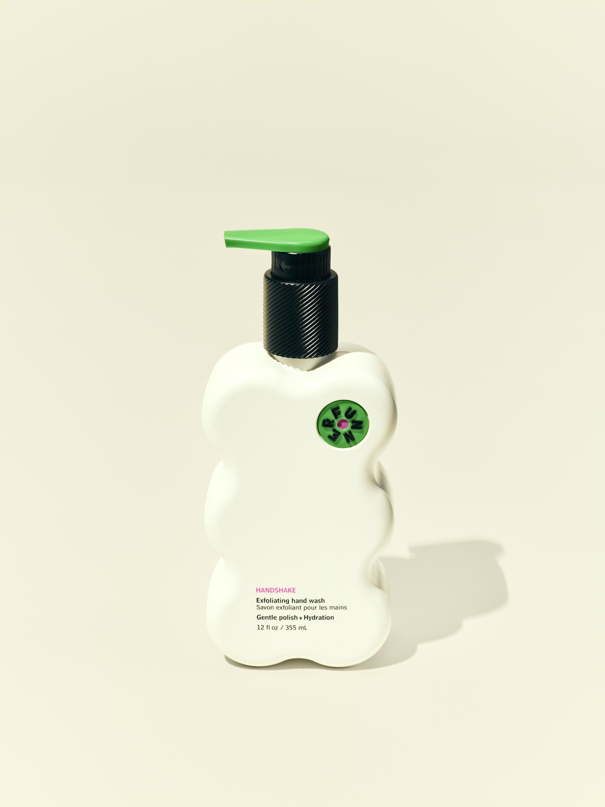 Front solo packshot of Handshake bottle against a beige background