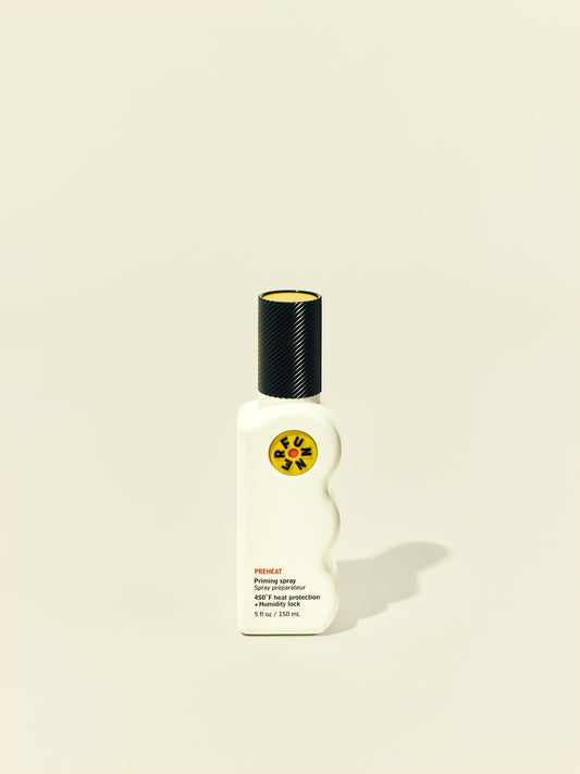 Front solo packshot of PreHeat bottle against a beige background