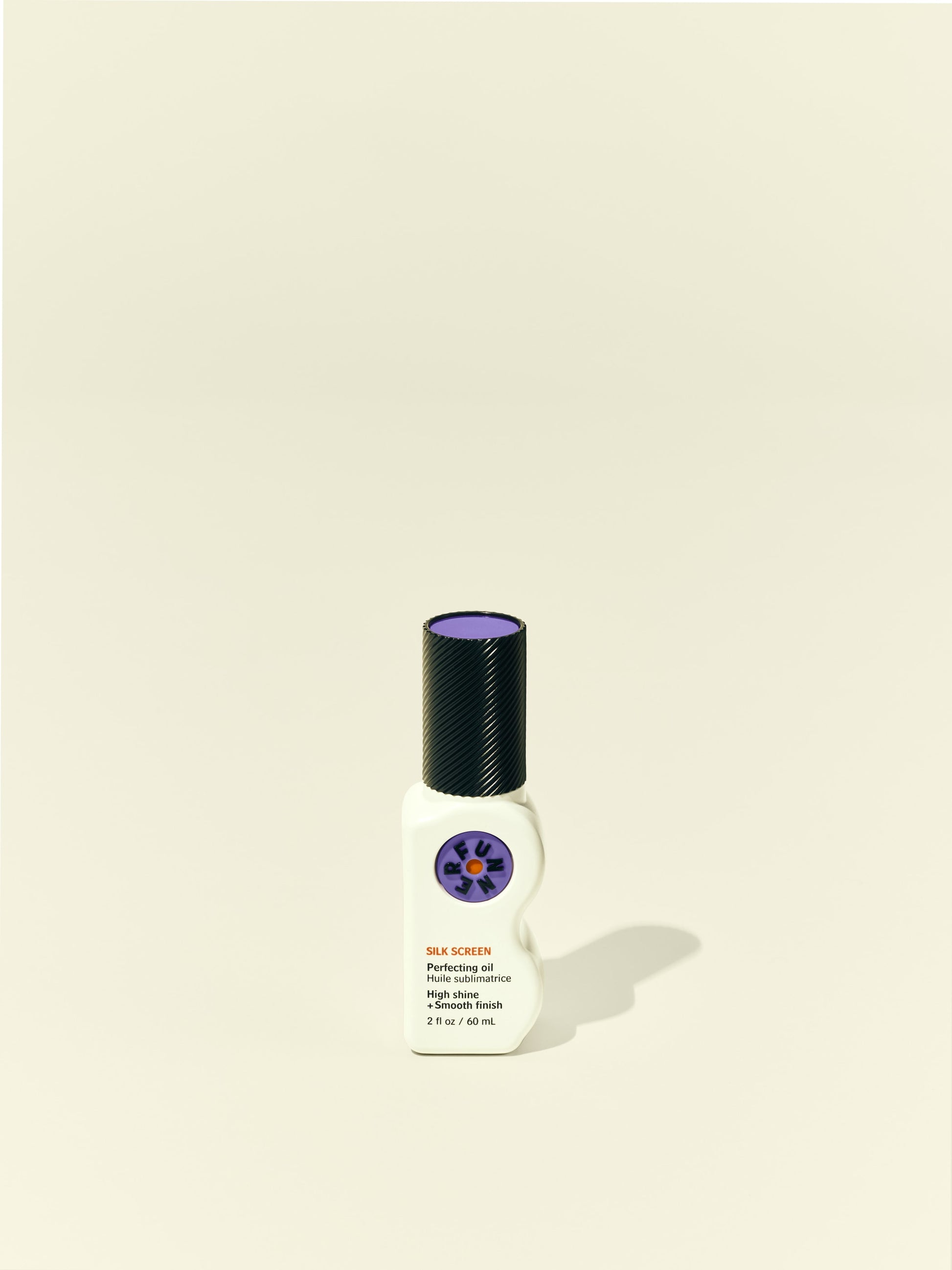 Front solo packshot of Silk Screen bottle against a beige background