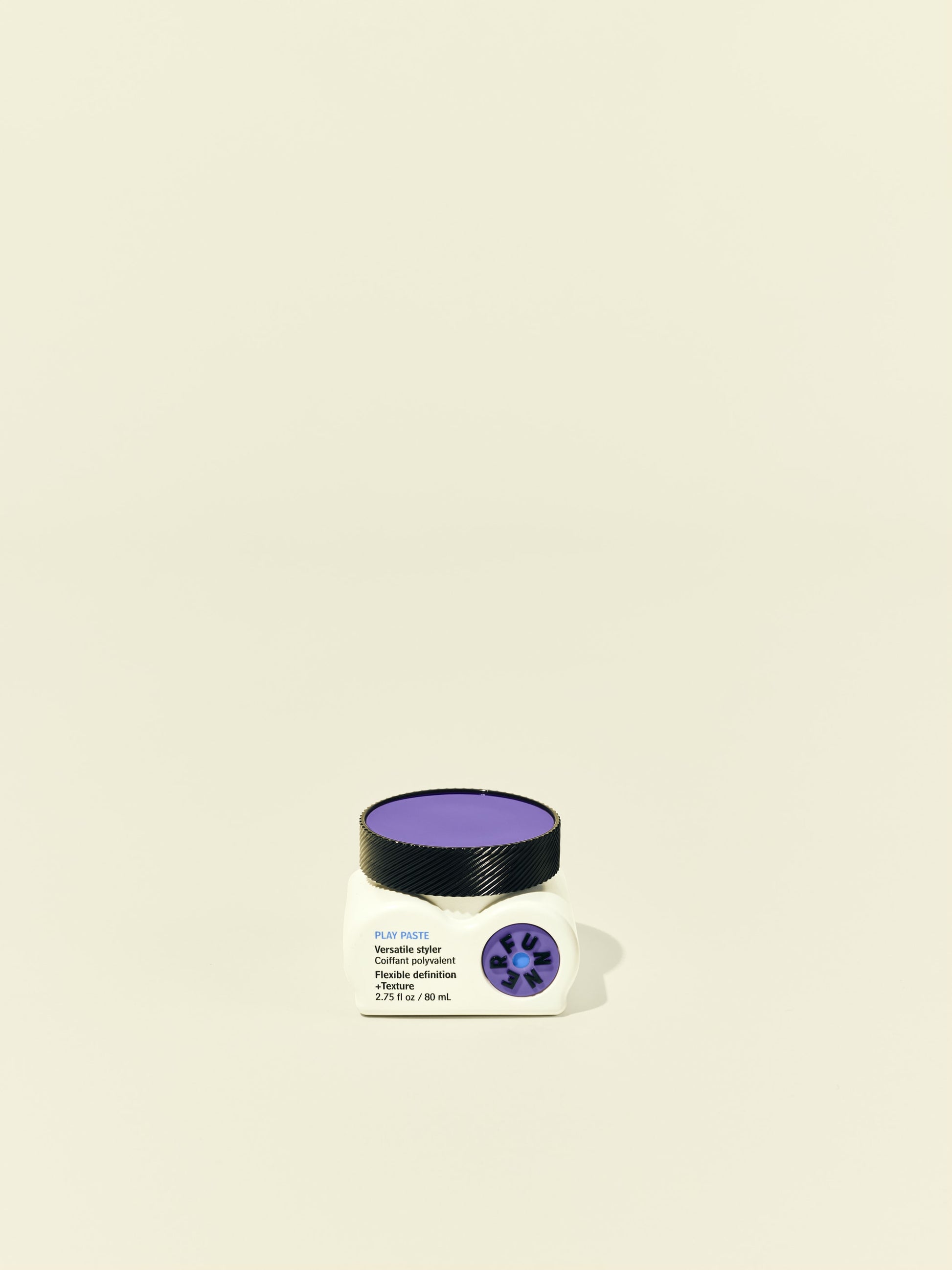 Front solo packshot of Play Paste jar against a beige background