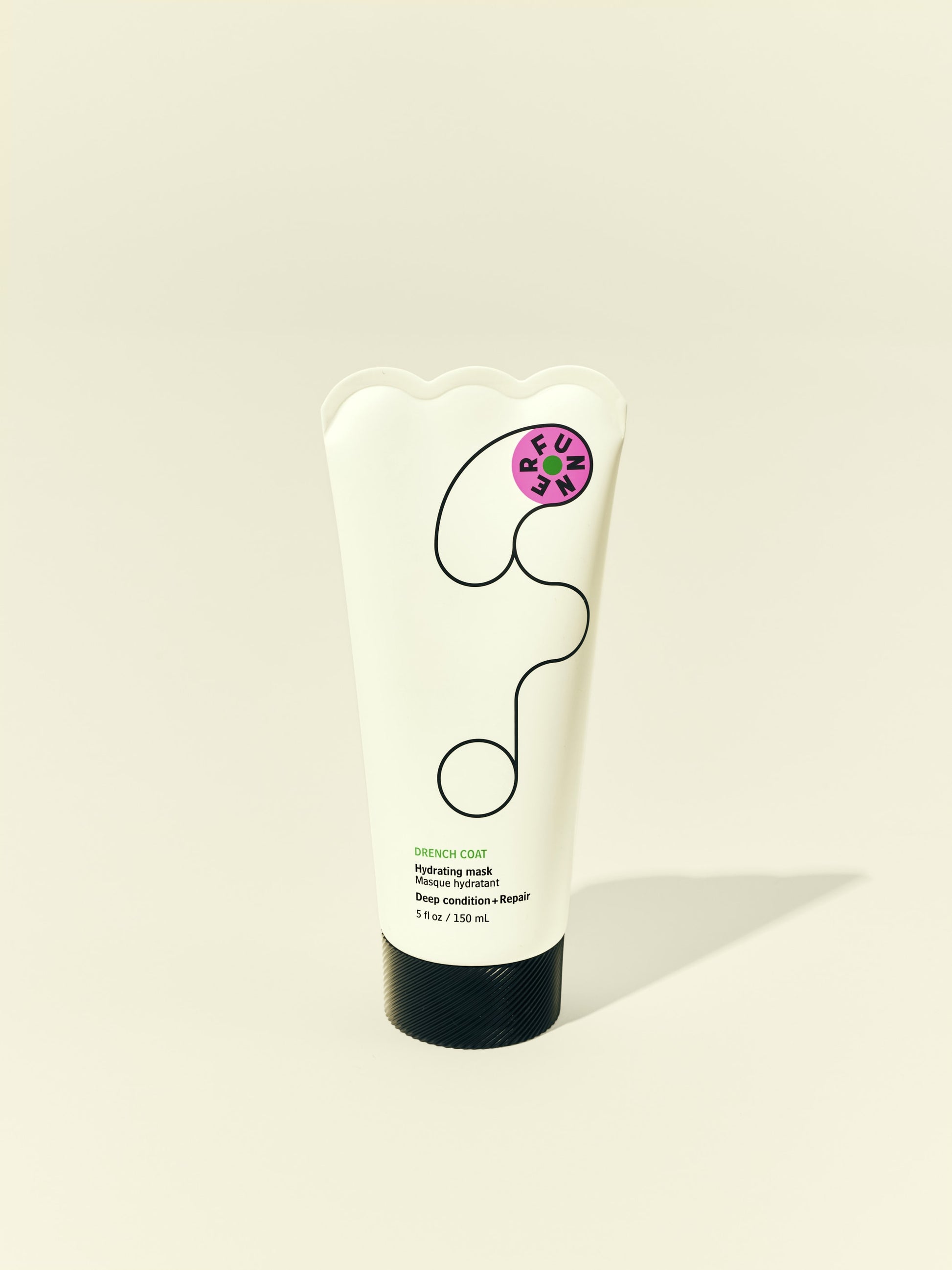 Front solo packshot of Drench Coat tube against a beige background