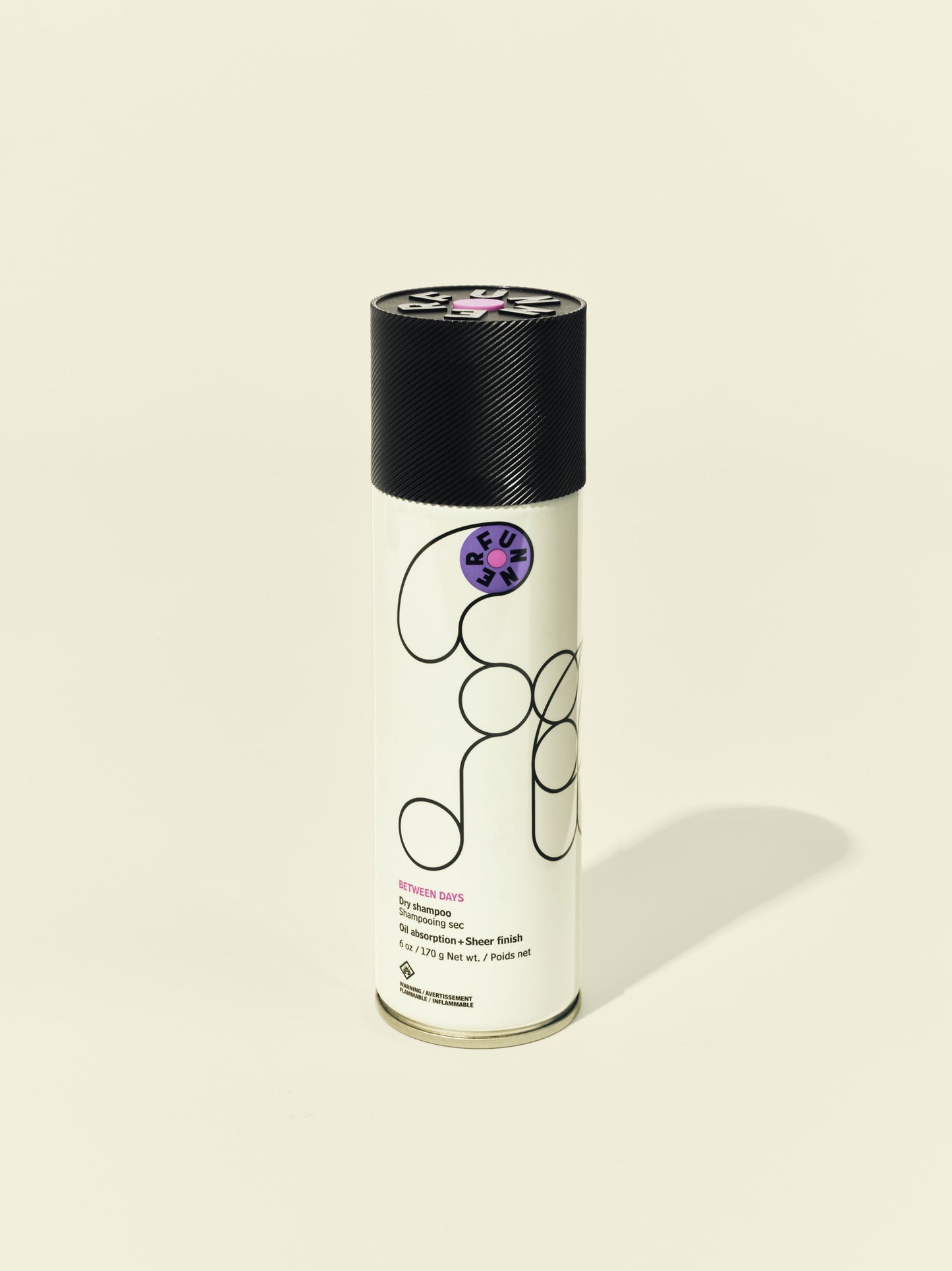 Front solo packshot of Between Days aerosol against a beige background