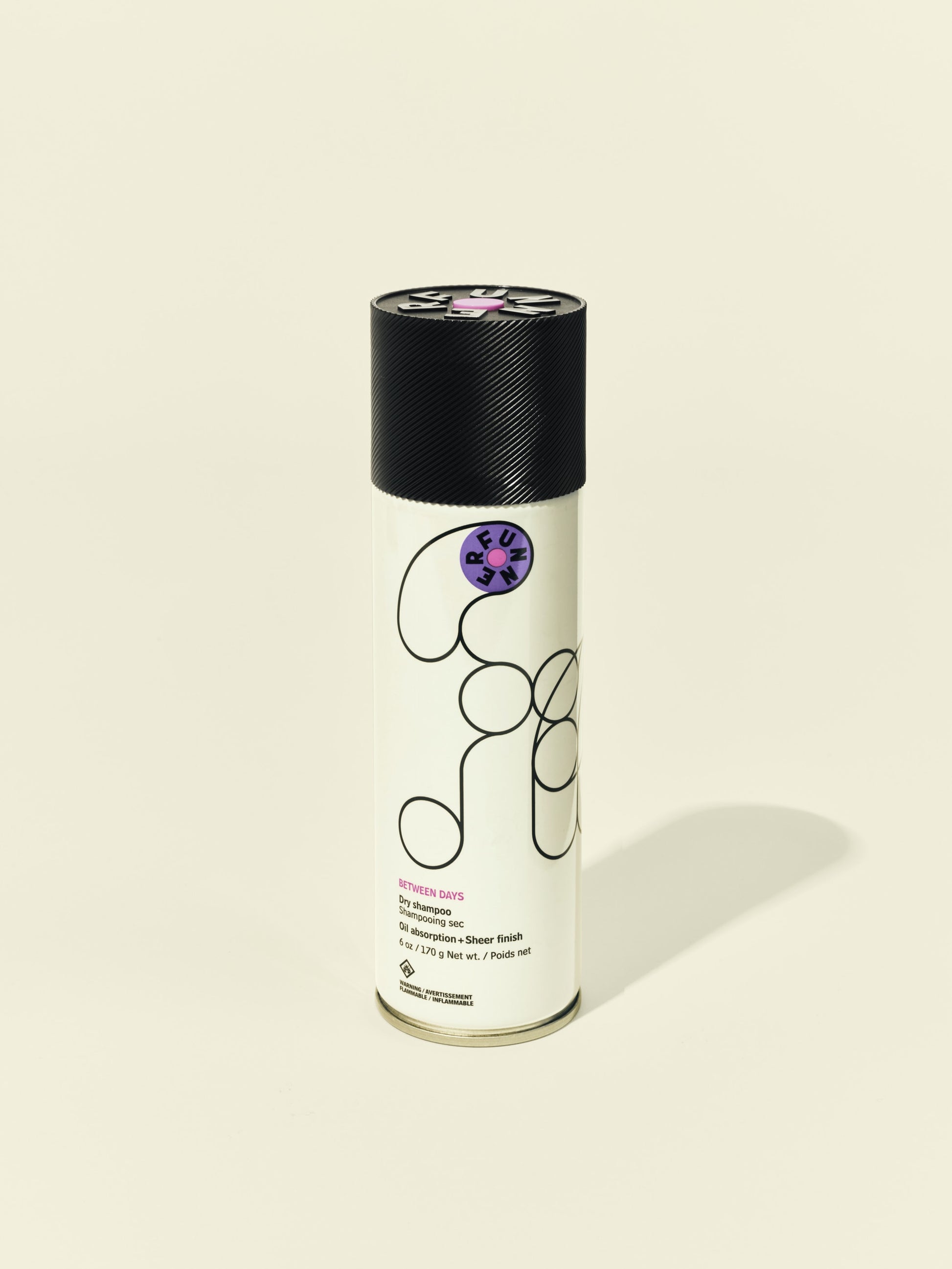 Front solo packshot of Between Days aerosol against a beige background