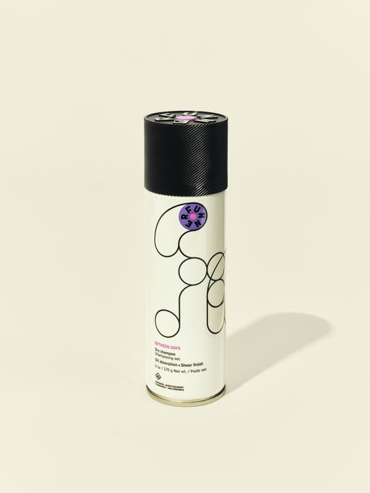 Front solo packshot of Between Days aerosol against a beige background
